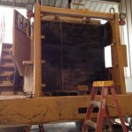 CAT 988 wheel loader with radiator exposed during service at St. Louis repair facility