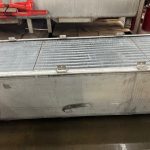 Industrial radiator repair in St. Louis facility showing large aluminum heat exchanger
