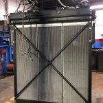 Rebuilt Komatsu radiator with reinforced frame at St. Louis heavy equipment repair shop