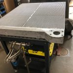 Liebherr radiator core on fabrication bench at St. Louis industrial cooling repair shop